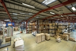 The site comprises narrow aisle and bulk storage areas.